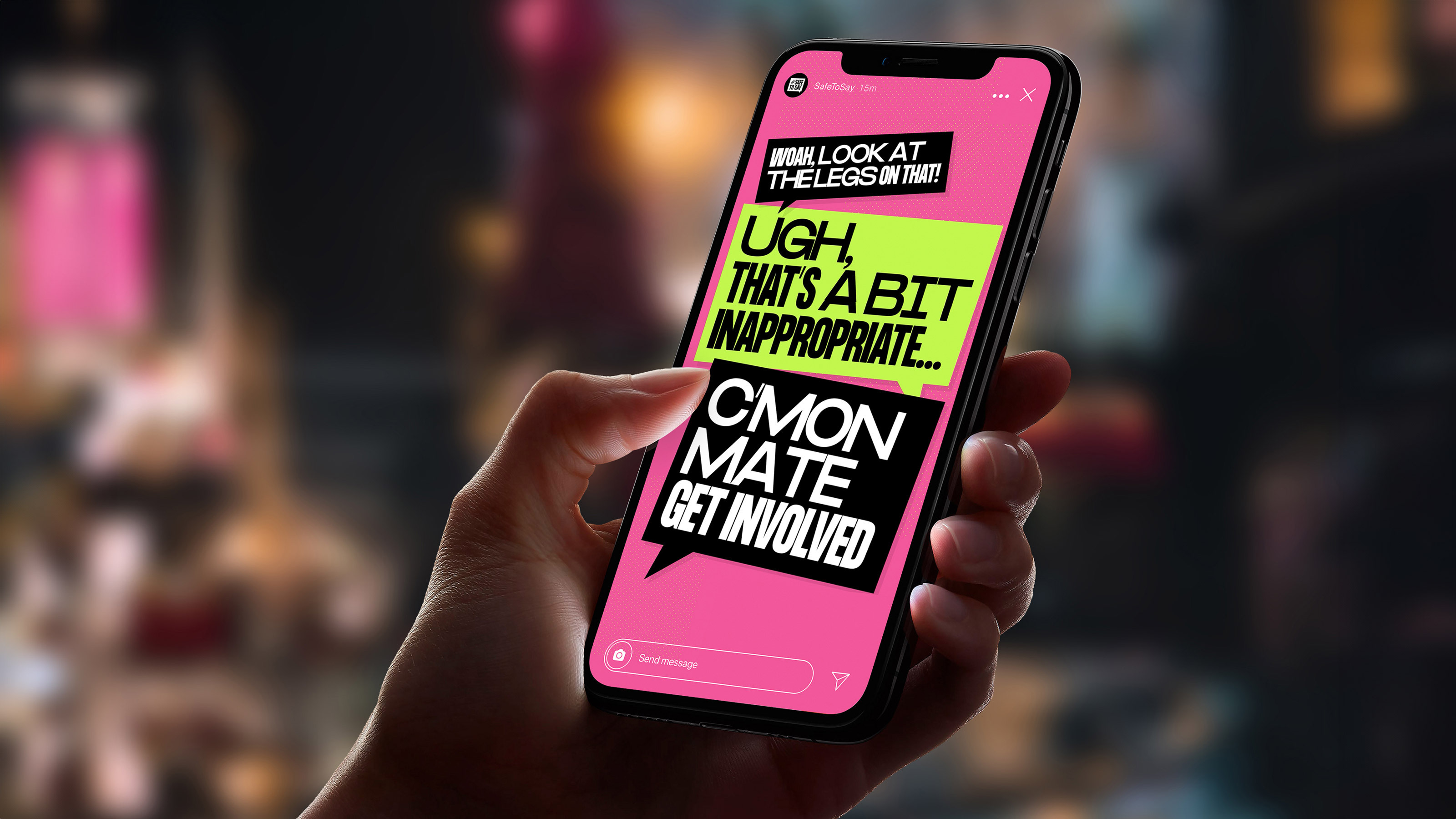 A woman holding a phone showing the SafeToSay campaign