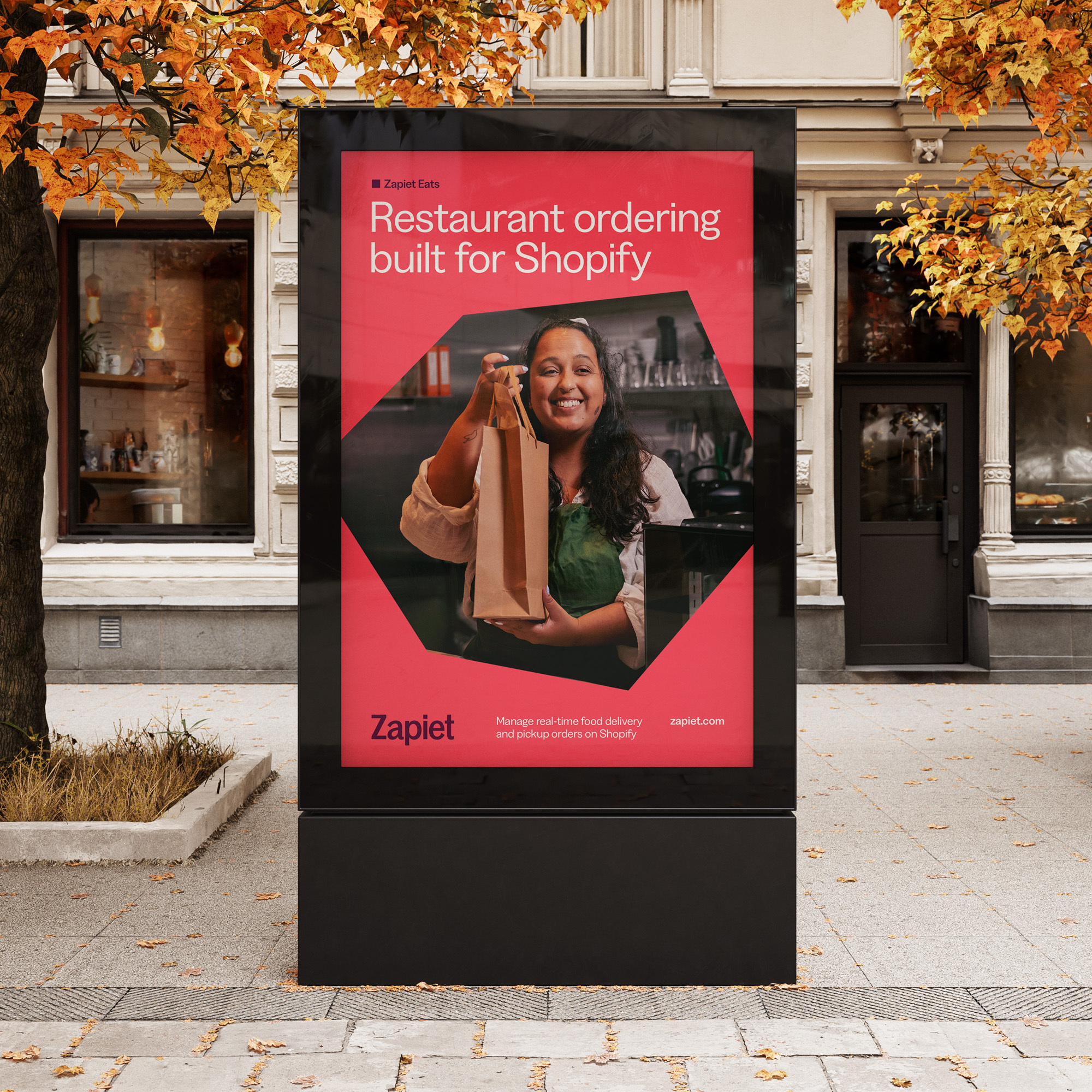 Digital advert billboard on a high street with Zapiet advert being displayed